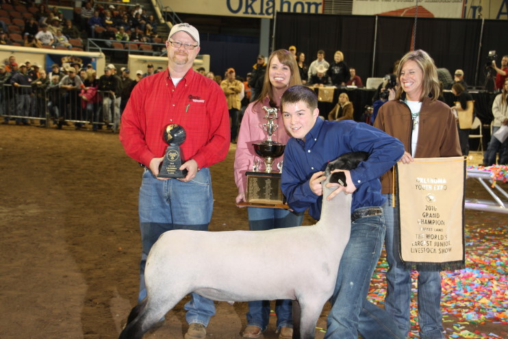 Tyler Rhoads of Indiahoma FFA Wins Grand Champion Trophy in the Market Lamb Show
