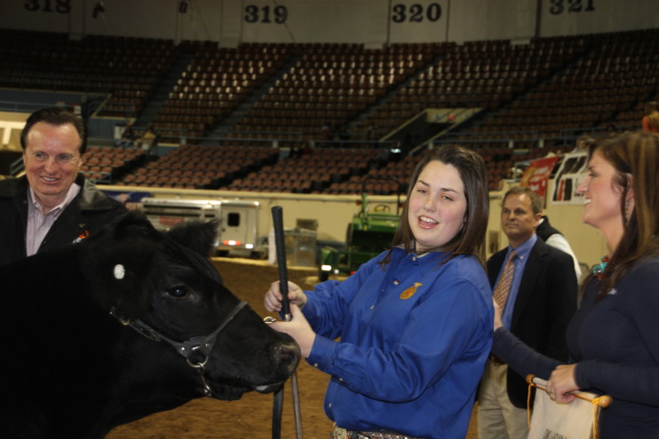 Bailey Buck of Madill FFA Wins Grand Champion Trophy in the Market Steer Show